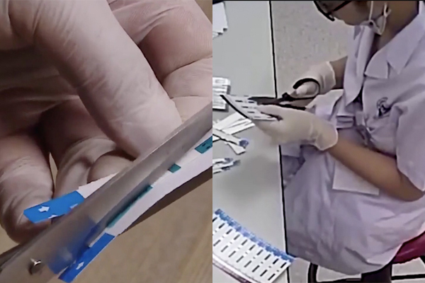 Hình ảnh kỹ thuật viên của khoa Vi sinh y học, BV đa khoa Xanh Pôn cắt đôi các que thử được camera ghi lại