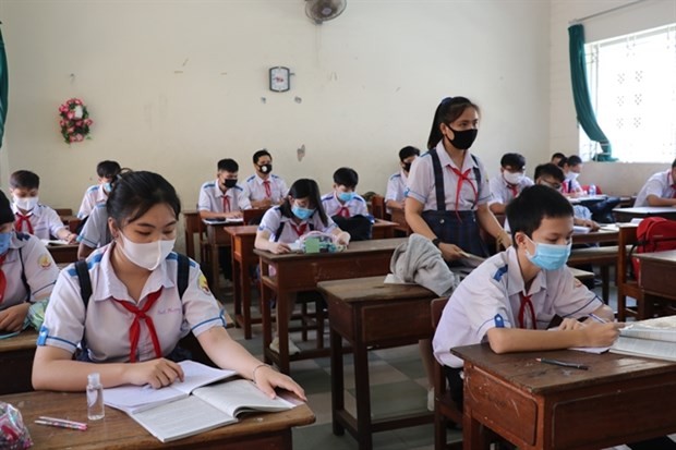 Safe distance is kept among students in a class in Long An province