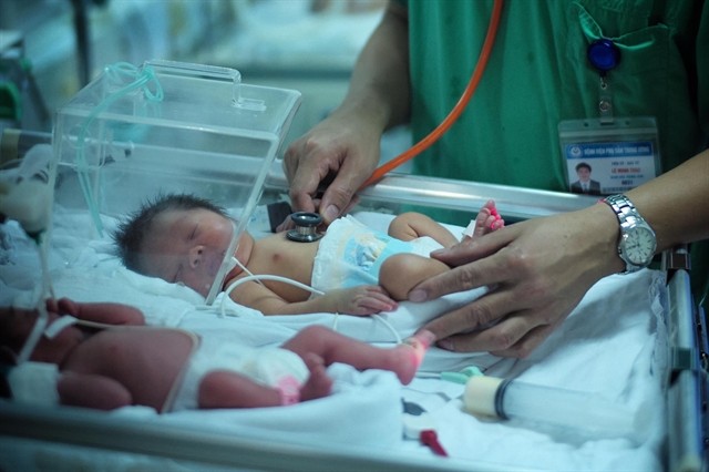 Newborns at the National Hospital of Obstetrics and Gynecology. The Government has asked local authorities to pilot policies to support couples to give birth and raise children.