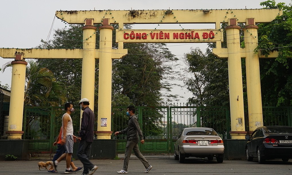 A man walks outside the Nghia Do Park in Hanoi’s Cau Giay District