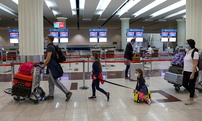 Passengers walk at Dubai International Airport, Dubai, UAE, April, 2020. Photo by Reuters/Ahmed Jadallah.