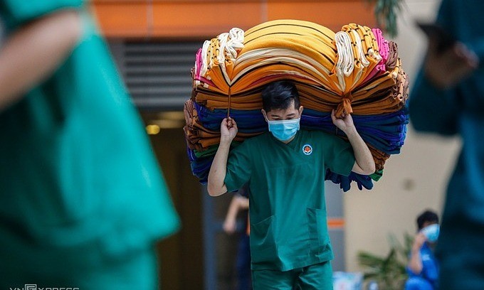 Facing its worst coronavirus outbreak yet, HCMC has no choice but to request help as doctors feel the daily brunt of rising new cases.