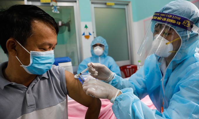 A man receives a Covid-19 vaccine shot in HCMC, June 21, 2021. Photo by VnExpress/Huu Khoa.