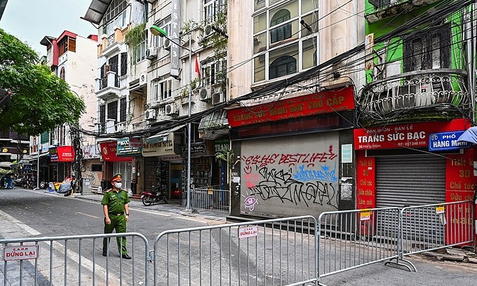 A part of Hanoi's Hang Mam Street was locked down after a Covid-19 case was detected on July 18, 2021. Photo by VnExpress/Giang Huy.