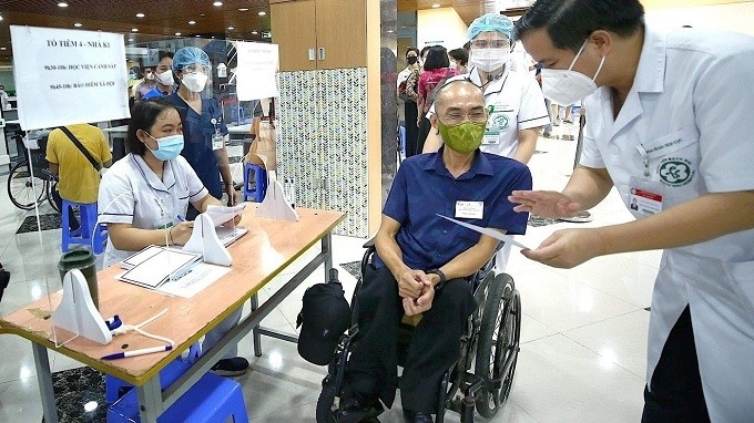 Doctors at Bach Mai Hospital assessing the health status of people with disabilities