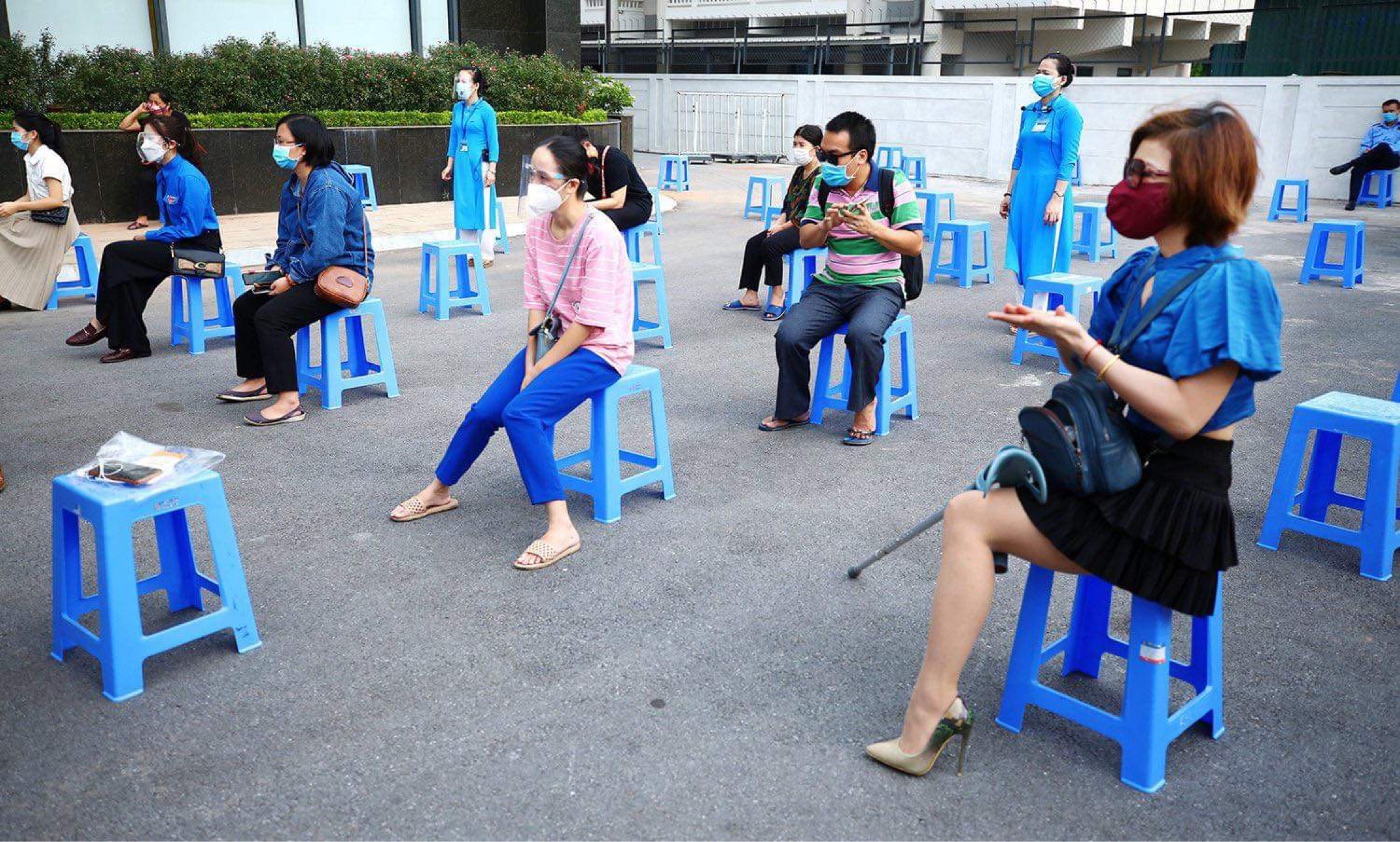 Workers queuing up and waiting for instructions