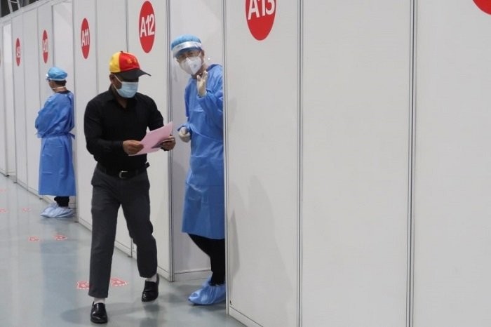 A man leaves a booth to after receiving a coronavirus disease (COVID-19) vaccine at a vaccination center, during a government-organized visit, in Beijing, China, April 15, 2021. (Photo: Reuters)