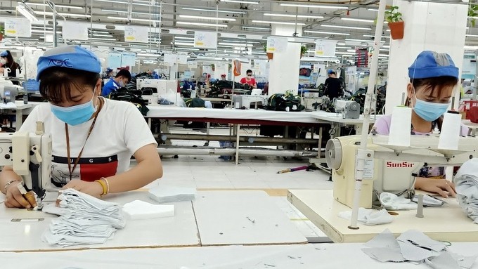 Workers from Nha Be Garment Joint Stock Company in Ho Chi Minh City before the fourth outbreak of COVID-19 pandemic. (Photo: NDO)