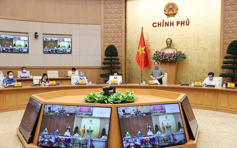 Prime Minister Pham Minh Chinh speaks at the meeting. (Photo: VNA)