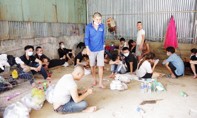 Vietnamese workers who escaped a casino in Cambodia stay at a border guard station in An Giang Province on August 18, 2022. Photo by An Giang border guard